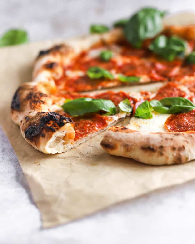 neapolitan-style pizza on a piece of parchment