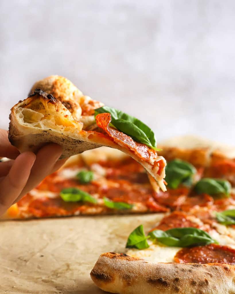 neapolitan-style pizza on a piece of parchment