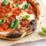 neapolitan-style pizza on a piece of parchment