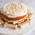 dog carrot cake on a cake stand